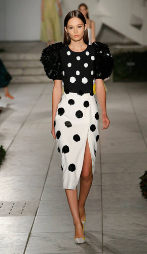 Black and white polka dot dress with thigh-high slit and balloon sleeves