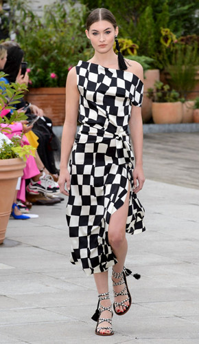 Black and white checkered one shoulder dress inspired from the fashion of 1990's