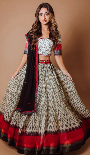 Elegant full flare chaniya choli in cotton silk with intricate hand embroidery, mirror belt and contrast dupatta. perfect for diwali festivities, a blend of tradition and style.