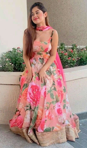 Embrace grace with our sleeveless floral lehenga in a stunning pink hue. adorned with mirror and bead work near the hemline, this tank top design features a deep neck, while the red dupatta adds a vibrant touch with diagonal lines and floral motifs.