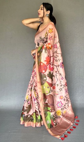 Experience summer elegance in our women's tissue light pink saree adorned with golden zari and abstract floral print. a fusion of tradition and modernity, featuring a plain black sleeveless blouse with a deep neckline.