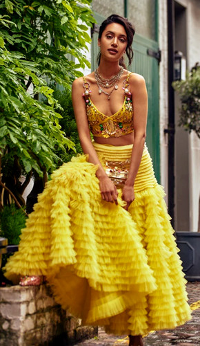 Lime yellow ruffled skirt with 3d embellished bralette. Lime yellow ruffled skirt with 3d embellished bralette.