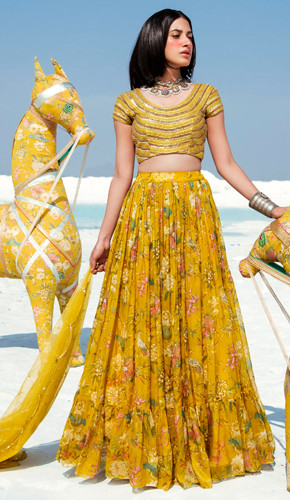mustard yellow lehenga set with intricate embellishments and embroidery