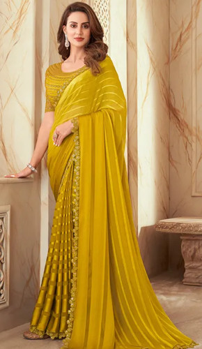 Yellow silk party wear saree with border work and a round neck blouse. Yellow silk party wear saree with border work and a round neck blouse.