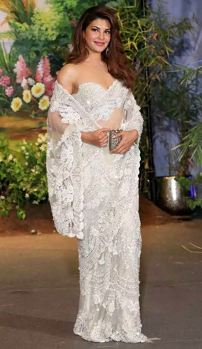 Jacqueline's sultry white lace saree with deep-neck blouse at sonam kapoor's reception showcased elegance and boldness
