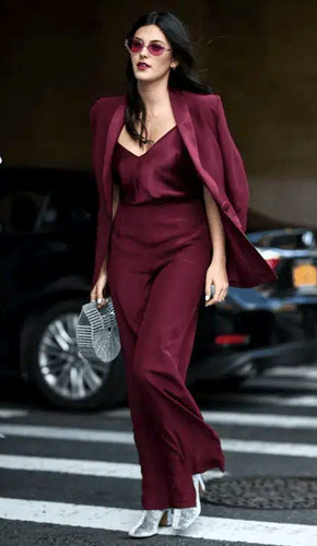 Deep burgundy pantsuit with fun accessories, complementing pale skin and dark hair. Deep burgundy pantsuit with fun accessories, complementing pale skin and dark hair.