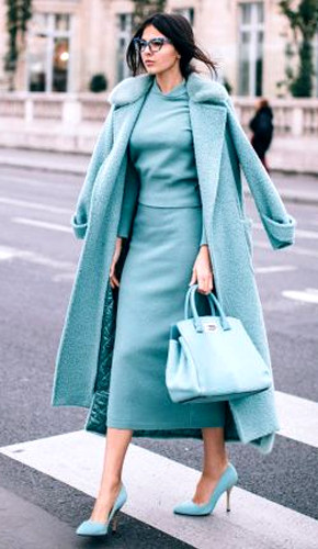 Turquoise monochromatic outfit with long skirt, top, jacket, and pointed heel stilettos. Turquoise monochromatic outfit with long skirt, top, jacket, and pointed heel stilettos.