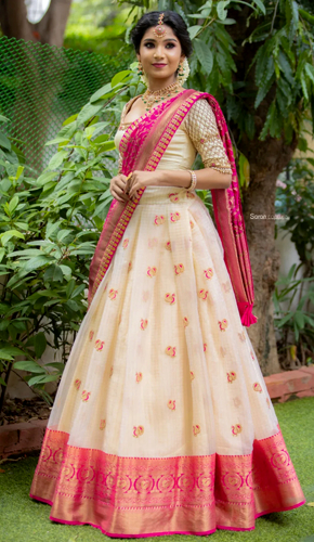 Elegant off-white & rani pink traditional half saree set with organza silk skirt and matching embroidered blouse
